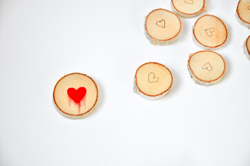 Pine tree slice with red blood heart symbol on white background. Valentines day wallpaper