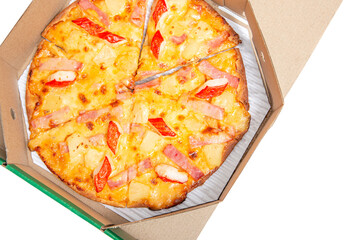 Hot Pizza in an open cardboard box. Tasty pizza with cheese, sausage, jalapenos and tomatoes on a white background. Top view.
