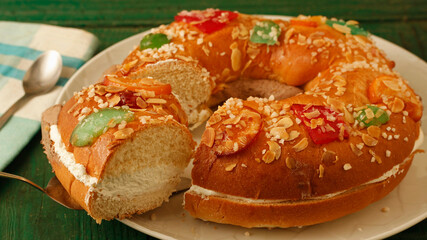 Roscón de Reyes with cream and chocolate. Typical hispanic pastry.