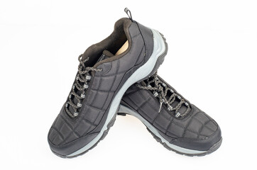 Black sports insulated shoes on white background. Studio Photo