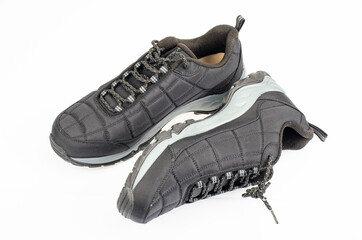 Black sports insulated shoes on white background. Studio Photo