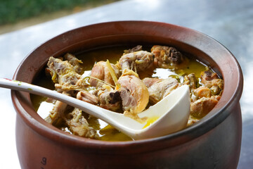 Vegetable curry chicken curry on a basin or stove made of clay.