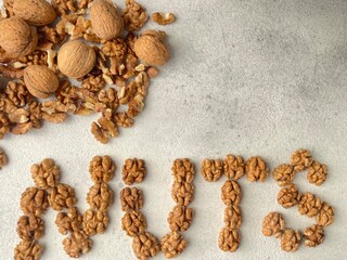 nuts written by walnuts seeds. Walnuts background. Healthy food concept.