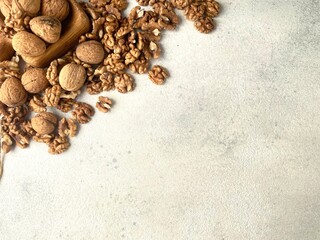Fototapeta na wymiar Walnuts background with space for text. Nuts seeds and shelled. Copy space