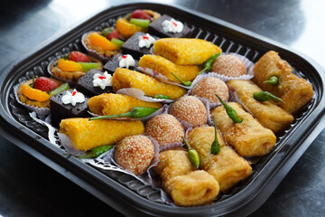 many traditional market snacks such as risoles, onde - onde, cakes and omelet rolls.