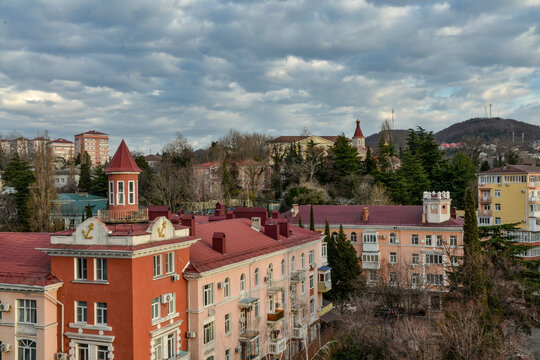 white clouds over roofs of houses and foothills of Northern Caucasus in Tuapse (Krasnodar krai, Russia) 