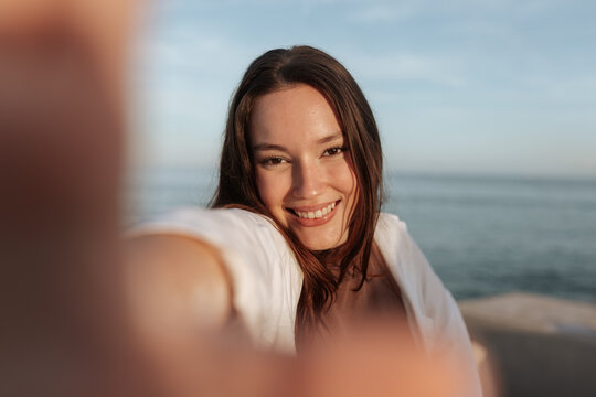 Happy Young Woman Taking A Selfie On Vacation