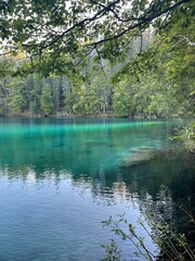 The Fusine lakes in Friuli Venezia Giulia Italy. Mountain lake, trees and lake, mountain and lake, lake and mountain panorama, blue water on the lake. Friuli excursions.Ideal for a summer picnic or a 