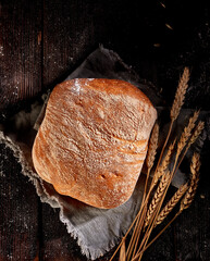 Wheat bread on a dark background
