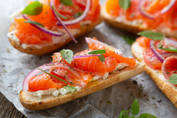 Sandwich with smoked salmon and cream cheese on a crispy baguette