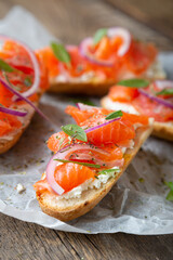 Sandwich with smoked salmon and cream cheese on a crispy baguette