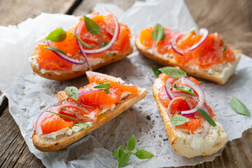 Sandwich with smoked salmon and cream cheese on a crispy baguette
