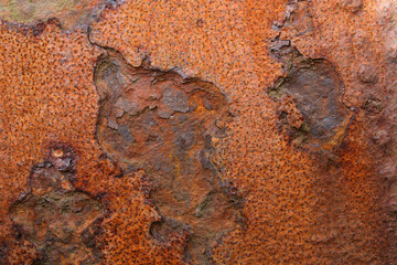 A close-up of rusting metal on a junkyard
