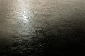 Abstract reflections on a frozen water surface