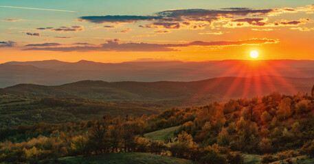 Plakat Spring Sunset over green mountains 