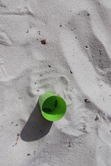 green toys in the white sandpit design for forgotten concept