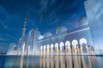 Night sky landscape view of grand white Sheikh Zayed mosque in Abu Dhabi, United Arab Emirates 