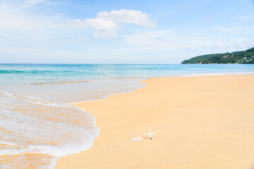 Beautiful sea middle two mountains blue sky background