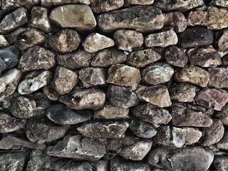 Old grunge stone wall for concept stone texture and background.
