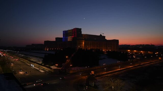 4K Video with the Palace of the Parliament from Bucharest light in the color of national flag of Romania. Wide view over this impressive building.