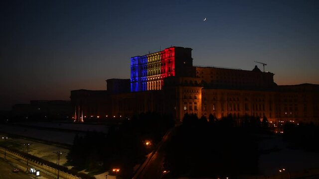 4K Video with the Palace of the Parliament from Bucharest light in the color of national flag of Romania. Wide view over this impressive building.