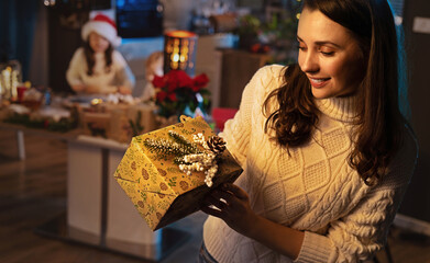 Happy mom and her daughter waiting for Christmas