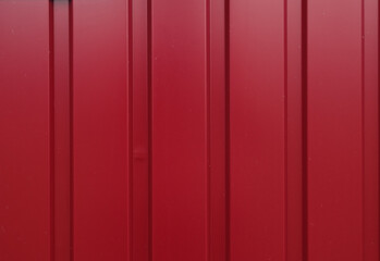 Texture of bright red burgundy matte metallic iron with vertical stripes