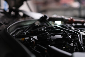 Fototapeta na wymiar Open engine hood of a automobile, close-up