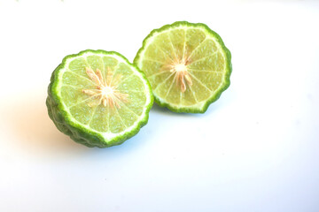 Naklejka na ściany i meble Kaffir Lime with leaves on white background