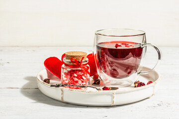 Hibiscus tea. The healthy hot organic drink is served in glass cups. St.Valentine's symbols