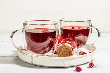 Hibiscus tea. The healthy hot organic drink is served in glass cups. St.Valentine's symbols