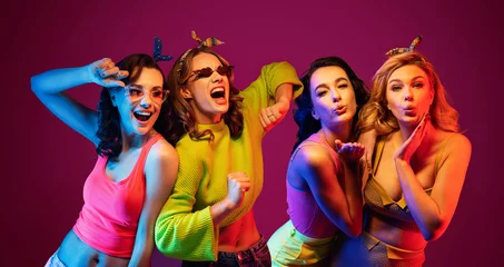 Foto op Canvas Group of four sexy beautiful young happy women © konradbak