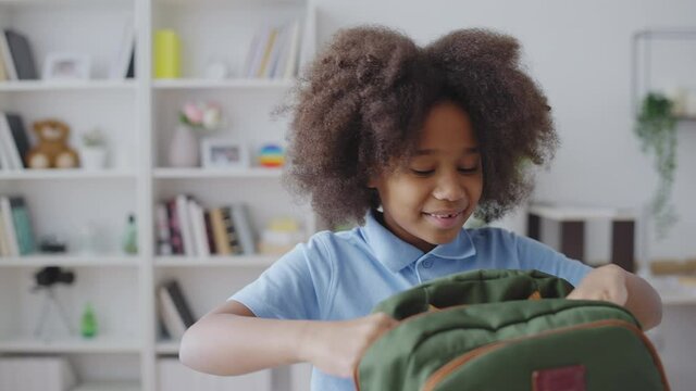 Little Girl Packing Books Into Backpack, Getting Ready For School, Education