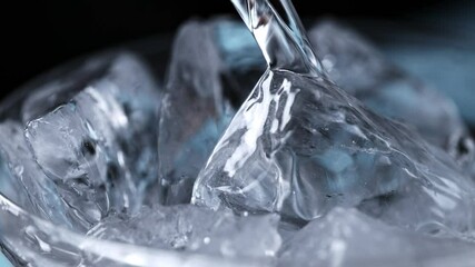 Super Slow Motion Detail Shot of Pouring Vodka on Ice Cubes at 1000 fps. - Powered by Adobe
