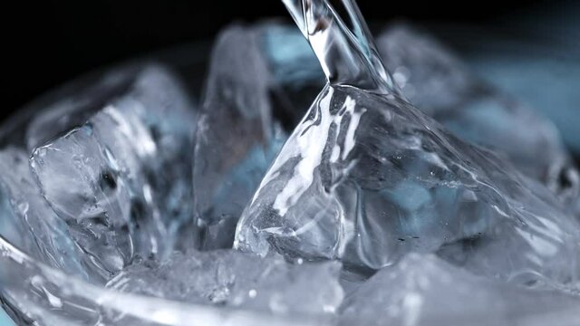 Super Slow Motion Detail Shot of Pouring Vodka on Ice Cubes at 1000 fps.
