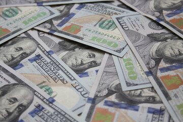 100 dollar US banknotes placed on a white background.