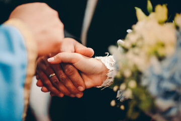 bride and groom holding hands