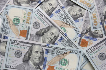 100 dollar US banknotes placed on a white background.