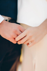 bride and groom holding hands