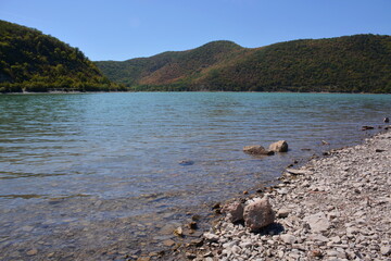 Emerald water of the mountain lake Abrau.