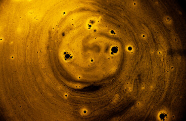 Galaxies and planets with black holes. Foam on the surface of the water with bubbles.