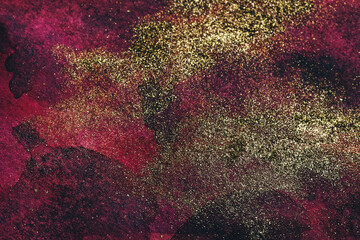 Abstract watercolor background in burgundy tones with golden splashes