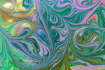 Abstract fluorescent ink mix with gold dust.