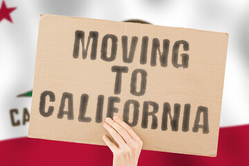 The phrase " Moving to California " on a banner in men's hand with blurred sea on the background. Relocation. Beach. Sun. Relax. Warm. Apartment. Relocating. Traveler