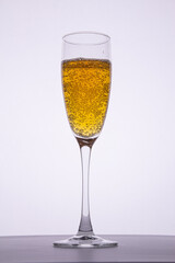 A glass of champagne with bubbles.