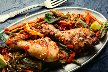 Chicken legs stewed with spices and vegetables.
