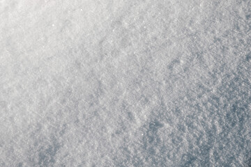 Pure white snow in winter. Sparkling snow close up.