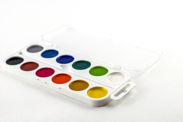 a box with watercolor paints on a white background close-up