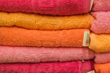 Colorful clean towels soft hygiene at home in bathroom background