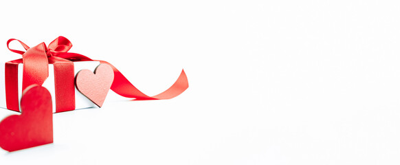 Valentine greeting card. Red heart, romantic gift with red ribbon on love white background. Valentines day decoration card with copy space.